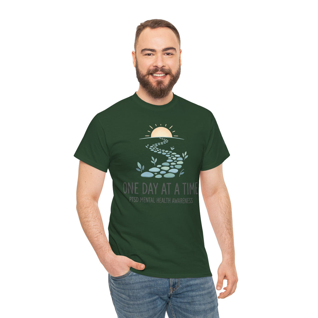 Green PTSD mental health awareness t-shirt from Veteran Owned, featuring a stepping stone path graphic, worn with blue jeans.