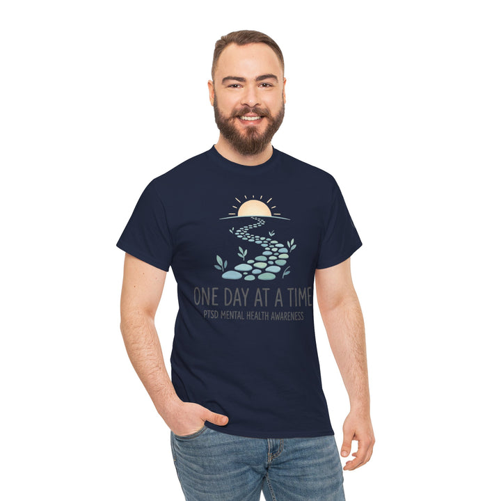 Navy t-shirt by Veteran Owned featuring a mental health graphic, worn with blue jeans.