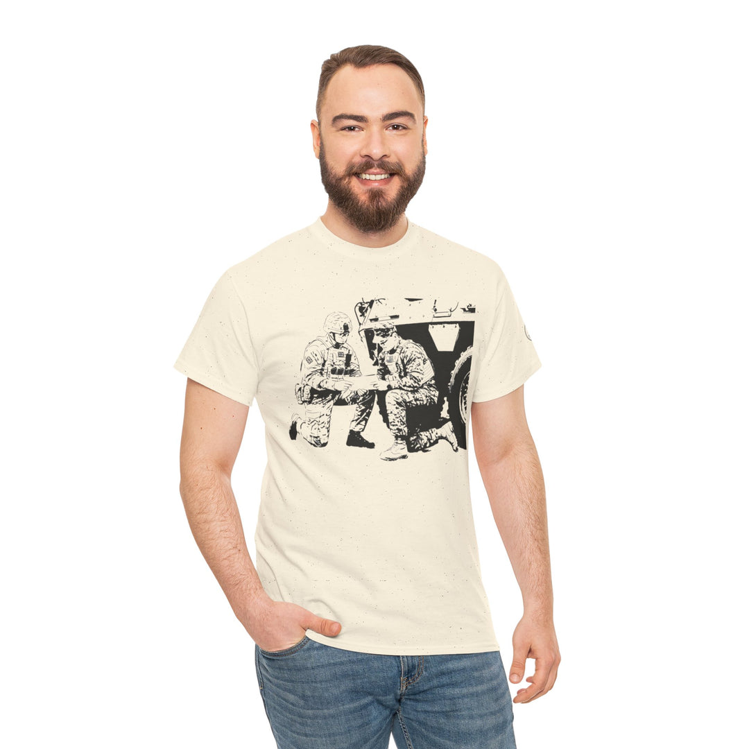 Cream-colored t-shirt by S&amp;W Gallus, featuring a military graphic print, styled with jeans on a smiling model.