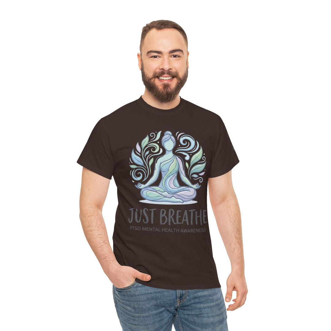 Brown graphic t-shirt by Veteran owned, featuring a yoga figure and "Just Breathe" text, styled with blue jeans.