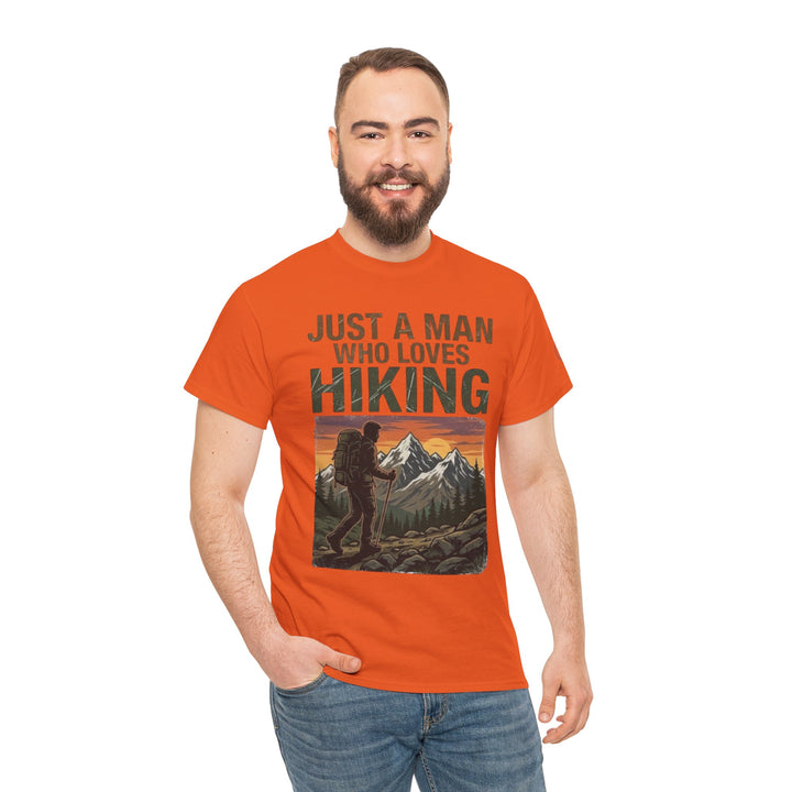 Orange hiking t-shirt by Veteran Owned, featuring a mountain graphic, worn with blue jeans.