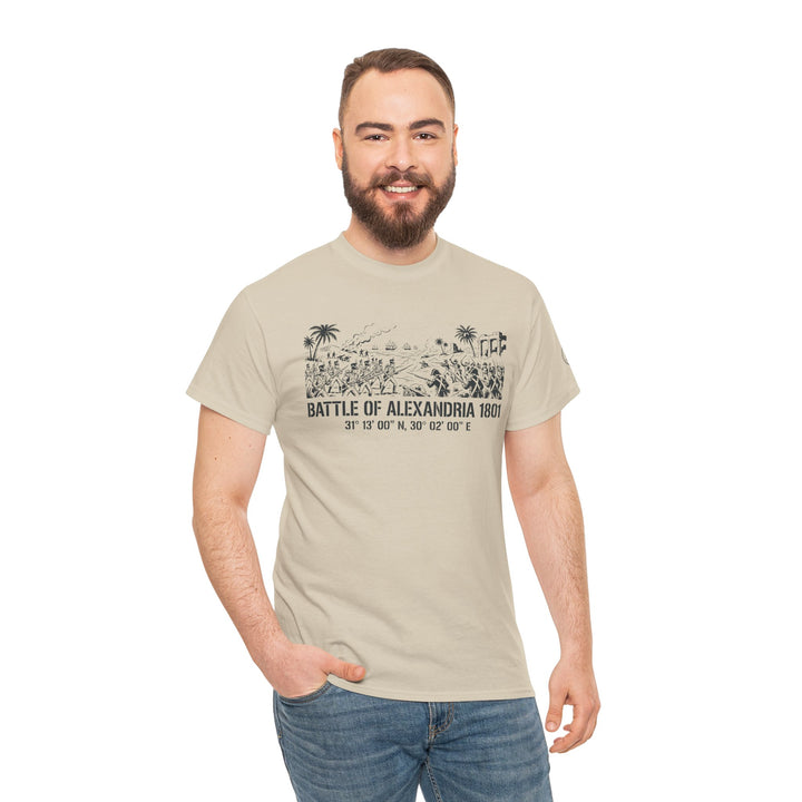 Sand-colored t-shirt with "Battle of Alexandria 1801" graphic by S&amp;W Gallus, paired with blue jeans on a smiling man.
