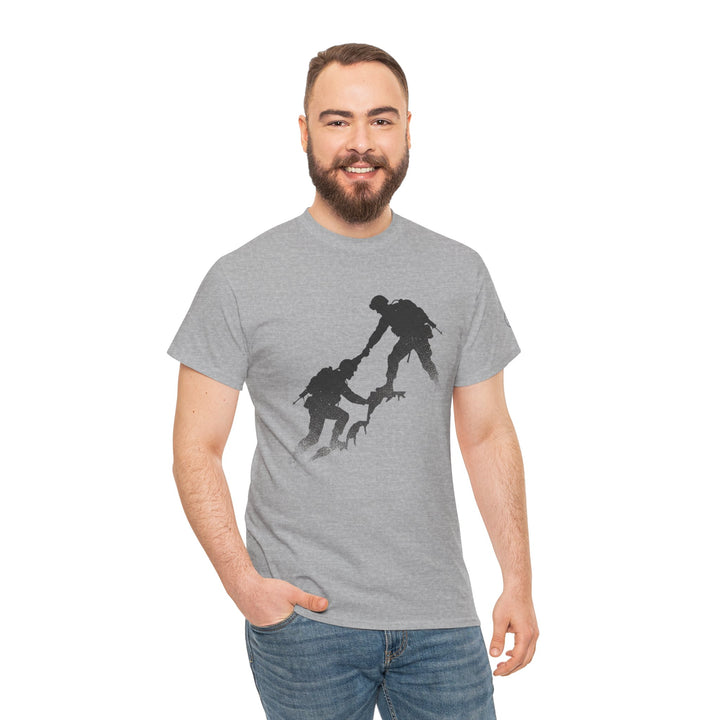 Gray t-shirt by S&amp;W Gallus featuring a silhouette graphic of two soldiers helping each other up a cliff.
