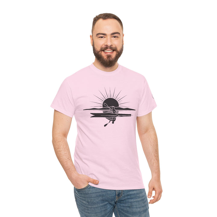 Pink t-shirt by S&amp;W Gallus, featuring a black graphic of a kayaker at sunset, worn with blue jeans.