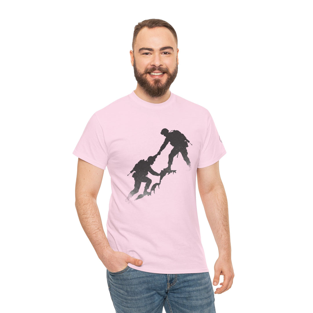 Pink t-shirt by S&amp;W Gallus featuring a silhouette graphic of soldiers helping each other climb, worn with blue jeans.