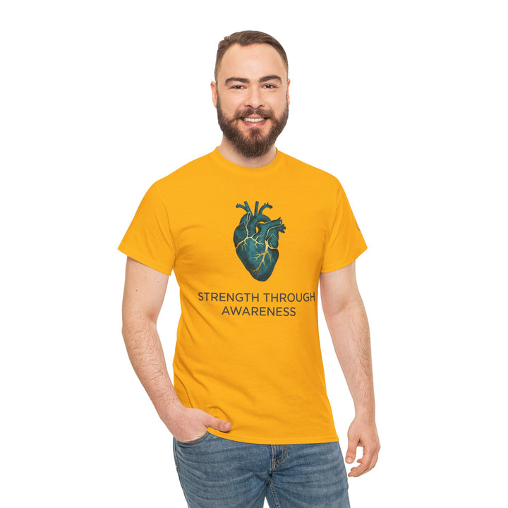 Yellow T-shirt by Veteran owned, featuring an anatomical heart graphic and the words "Strength Through Awareness", worn with jeans.
