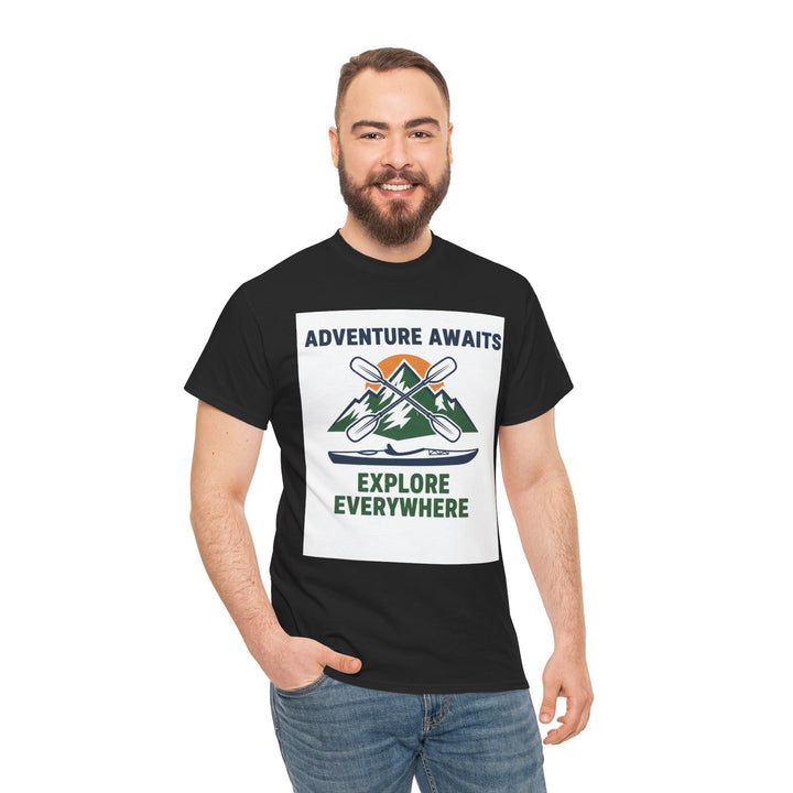 Black T-shirt by S&amp;W Gallus featuring a white adventure awaits graphic with kayak and mountain scene, paired with jeans.