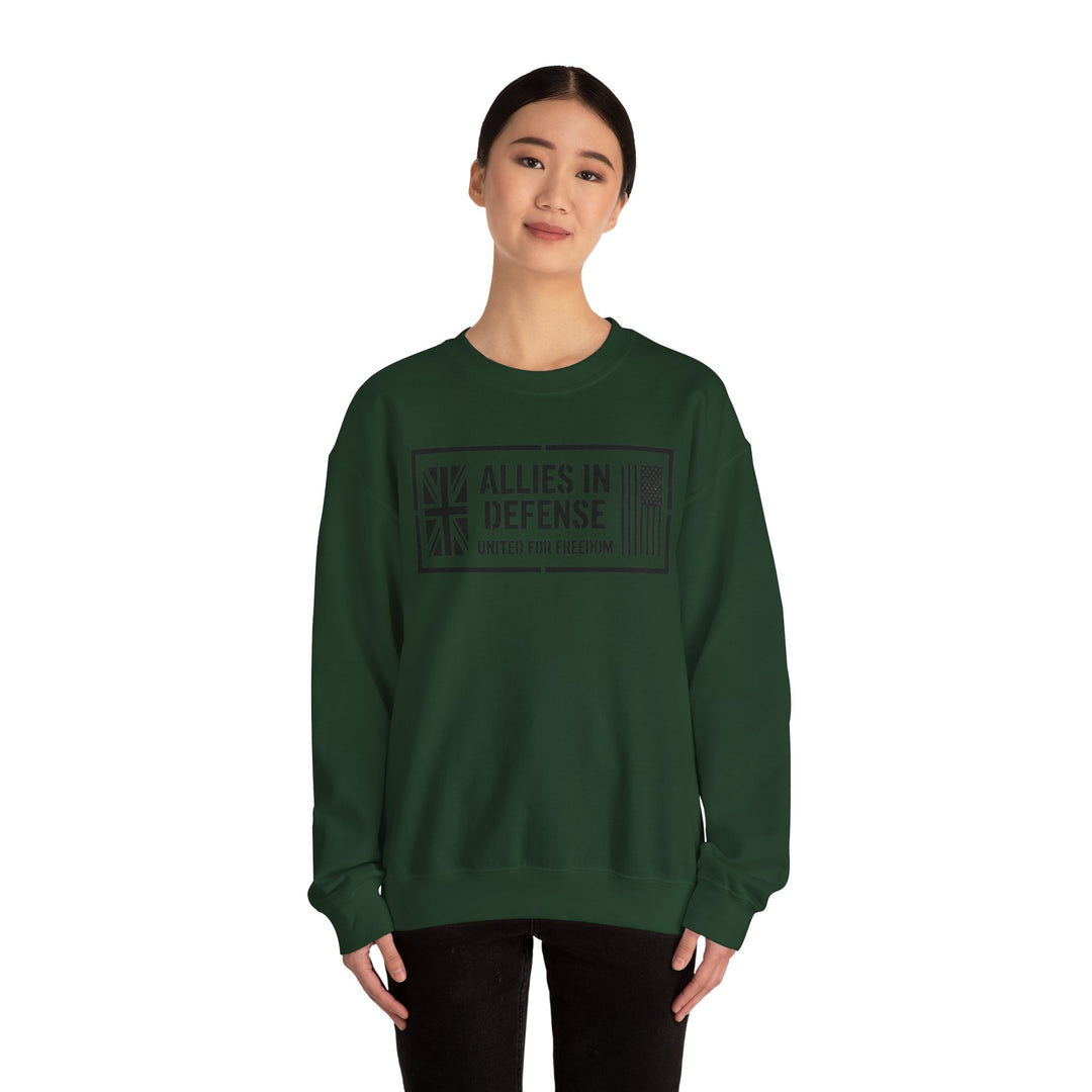 Forest green crewneck sweatshirt by S&amp;W Gallus, featuring "Allies In Defense" graphic, worn with black pants.
