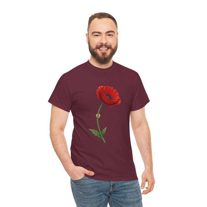 Burgundy t-shirt with poppy bloom by S&amp;W Gallus, worn with jeans by a smiling man with a beard.

