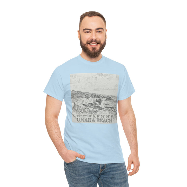 Light blue graphic tee by Veteran owned, displaying an illustration of Omaha Beach with coordinates, paired with jeans.