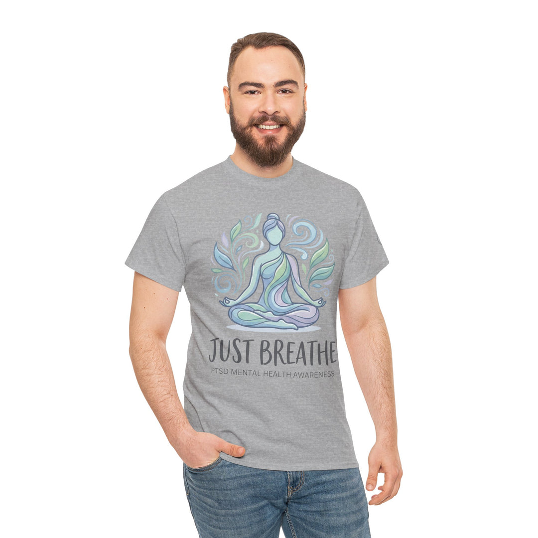 Gray T-shirt by Veteran owned, featuring a yoga pose graphic with "Just Breathe" text, worn with blue jeans.
