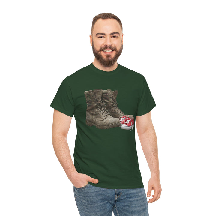 Green t-shirt by S&amp;W Gallus, featuring boots and baby shoes graphic, worn with blue jeans.