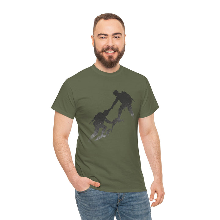 Olive green t-shirt by S&amp;W Gallus, featuring a silhouette graphic of hikers, worn with jeans.