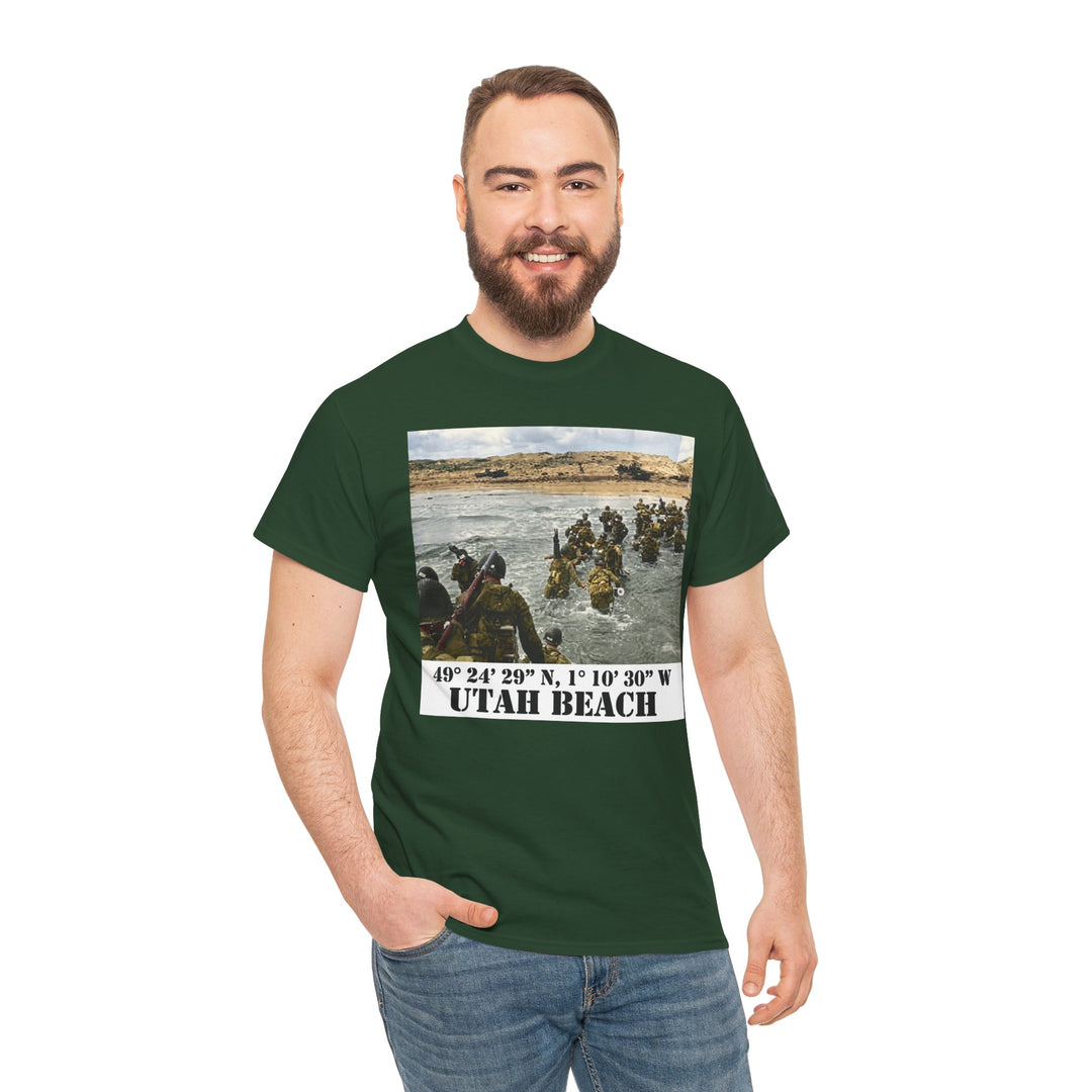Green Utah Beach D-Day T-shirt from Veteran Owned, featuring a vintage photograph and beach coordinates, worn with jeans.
