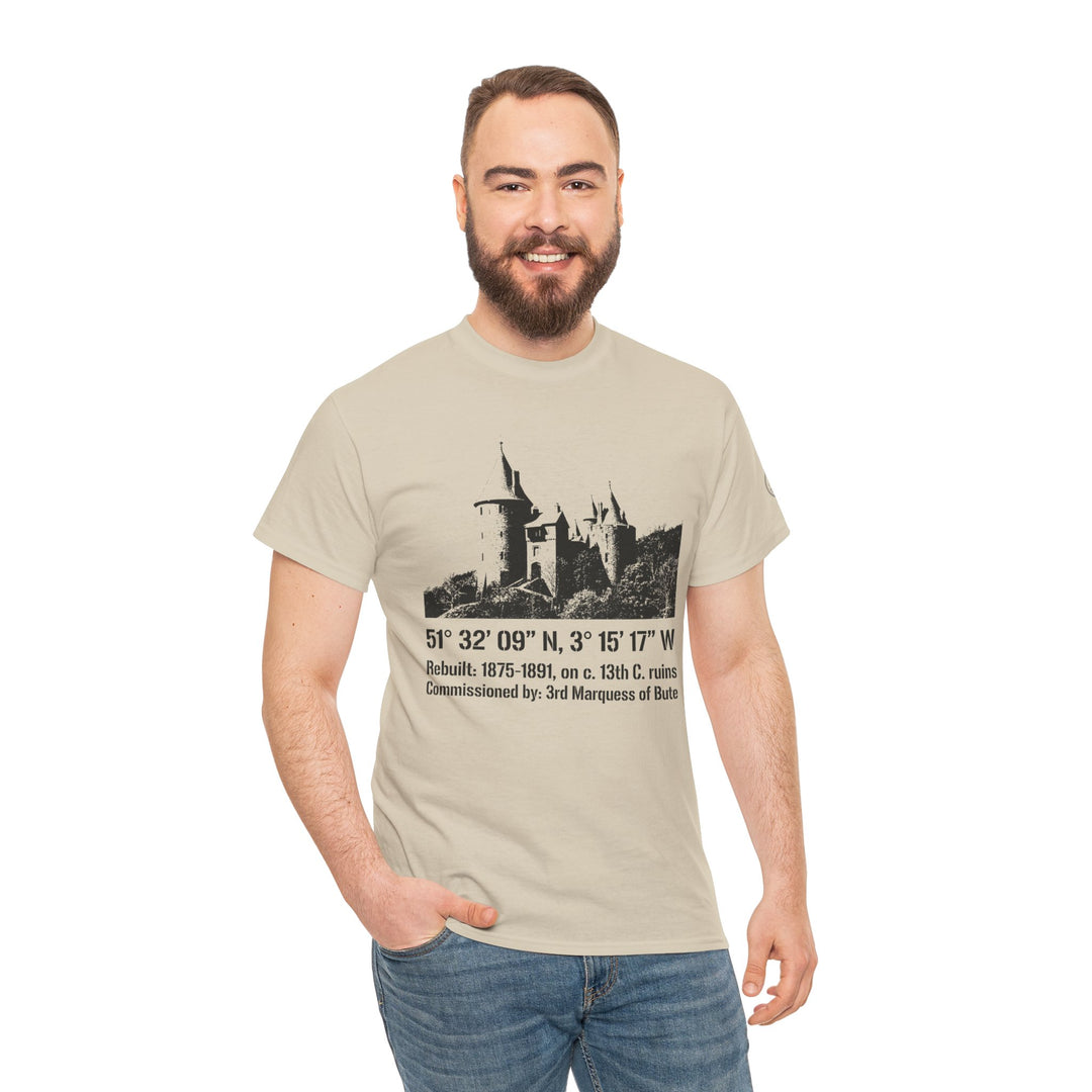 Beige t-shirt by S&amp;W Gallus, featuring a vintage Welsh castle illustration with text, worn with jeans and a smiling man.