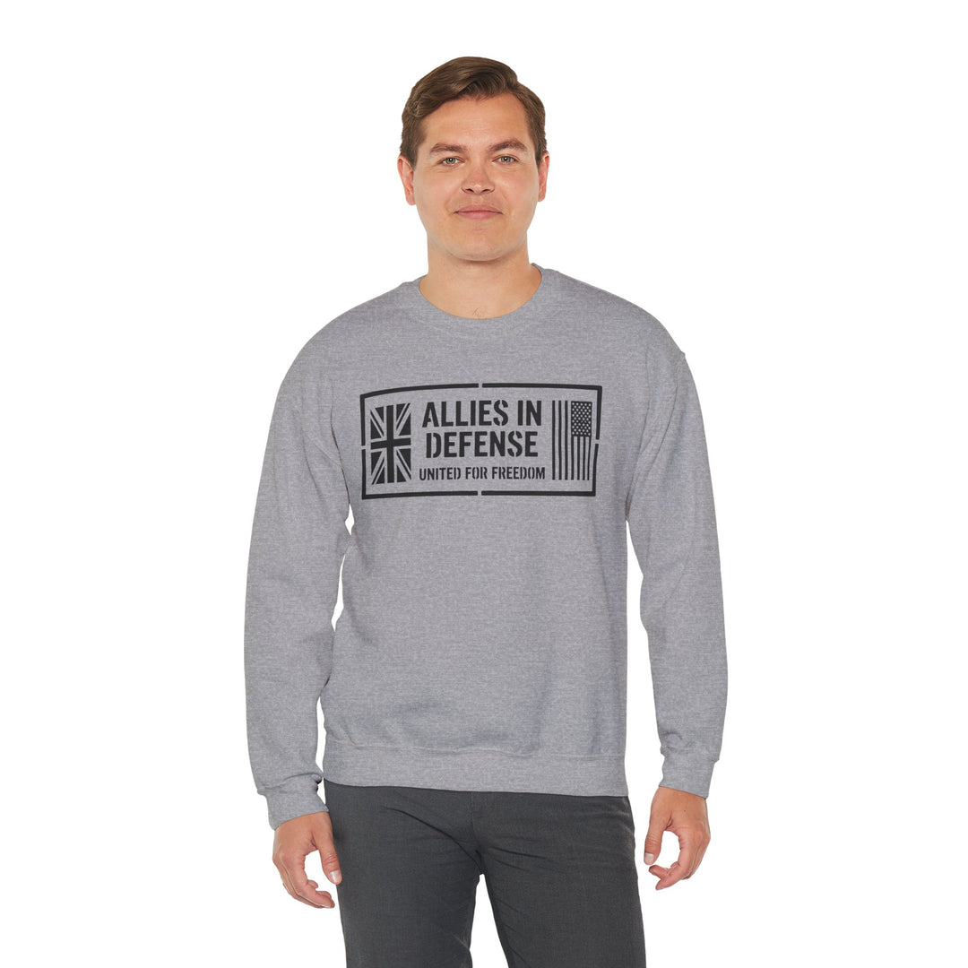 Gray crewneck sweatshirt with a freedom graphic by S&amp;W Gallus, worn with dark gray pants.