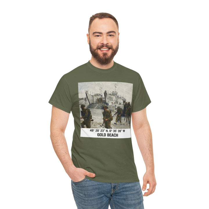 Olive drab t-shirt by Veteran owned, displaying a "Gold Beach" graphic with coordinates, worn with blue jeans.