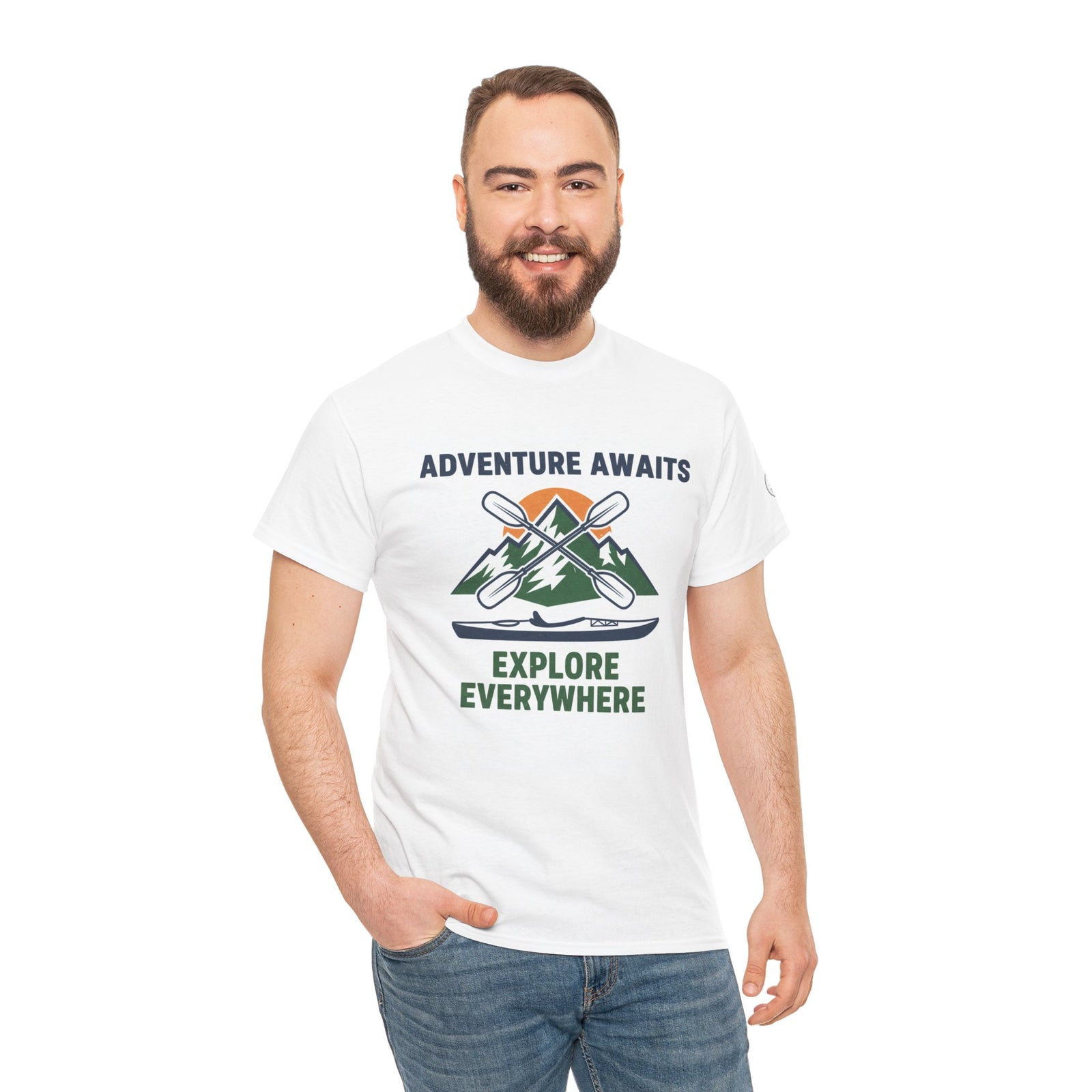White graphic t-shirt by S&W Gallus featuring a mountain and kayak design, worn with jeans.