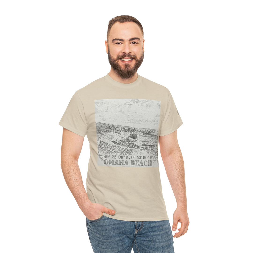 Beige graphic t-shirt by Veteran owned, featuring an Omaha Beach sketch, worn with jeans.
