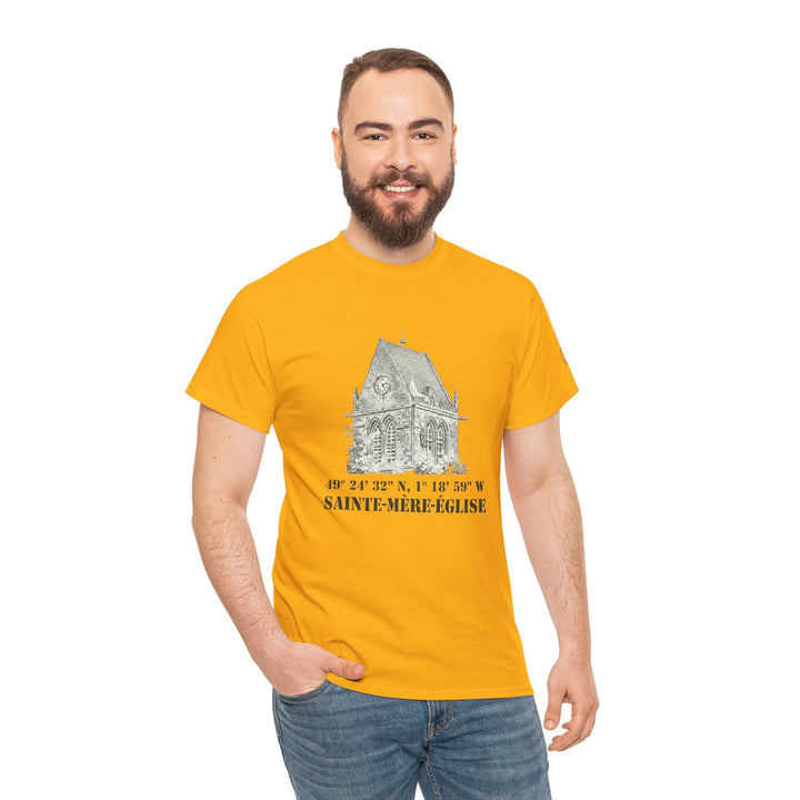 Mustard yellow t-shirt by Veteran owned, featuring a vintage church sketch and black text, paired with jeans.