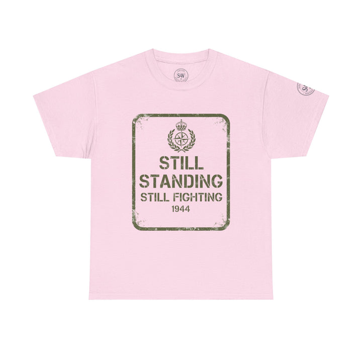 Light pink t-shirt by S&amp;W Gallus with a distressed "Still Standing" graphic in olive green.
