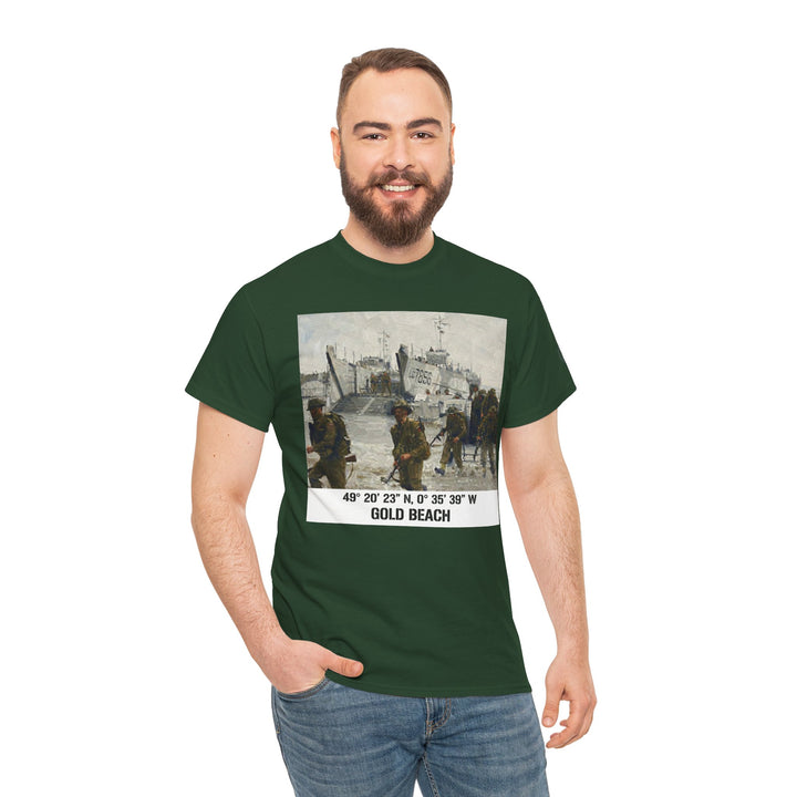 Green graphic t-shirt by Veteran owned, featuring a "Gold Beach" D-Day Normandy scene, worn with jeans by a smiling man.
