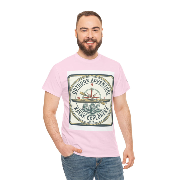 Pink T-shirt by S&amp;W Gallus, featuring a kayak explorers graphic on the front, worn with blue jeans.
