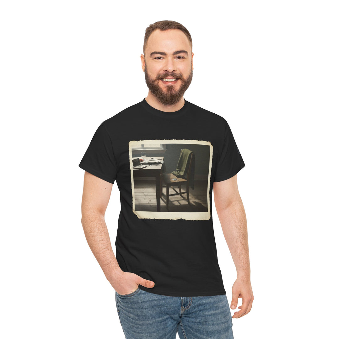 Black graphic tee by S&amp;W Gallus featuring an old-fashioned room with a chair and table, worn with blue jeans.