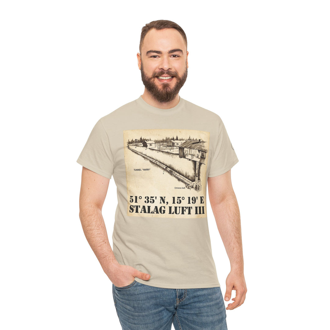 Beige graphic t-shirt by Veteran owned, featuring a Stalag Luft III drawing with coordinates, worn with jeans.