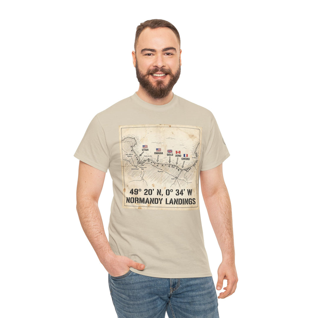 Sand-colored t-shirt by Veteran Owned featuring a Normandy landings map graphic, shown on a smiling bearded man wearing jeans.