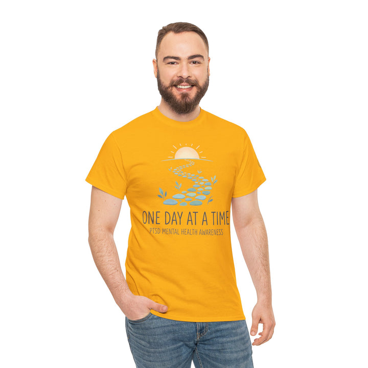 Mustard yellow t-shirt with a mental health awareness graphic, from Veteran owned, on a man in jeans.