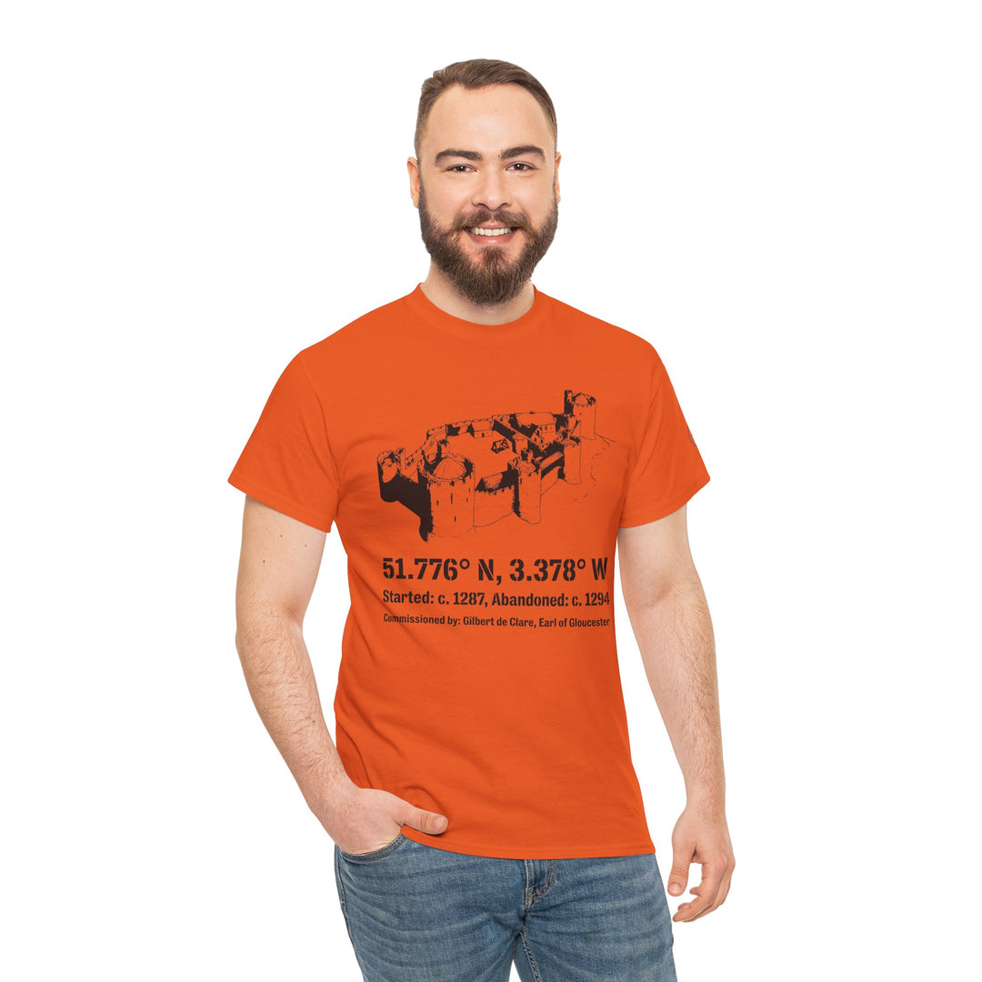 Orange Morlais Castle T-shirt by S&amp;W Gallus, featuring a castle graphic and location coordinates, worn with jeans.