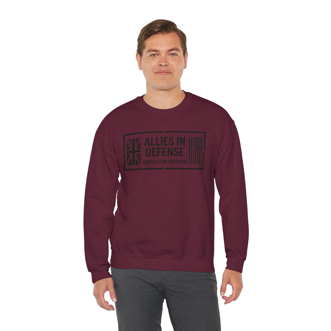 Maroon crewneck sweatshirt by S&amp;W Gallus, featuring the Allies In Defense graphic on the front, paired with gray pants.