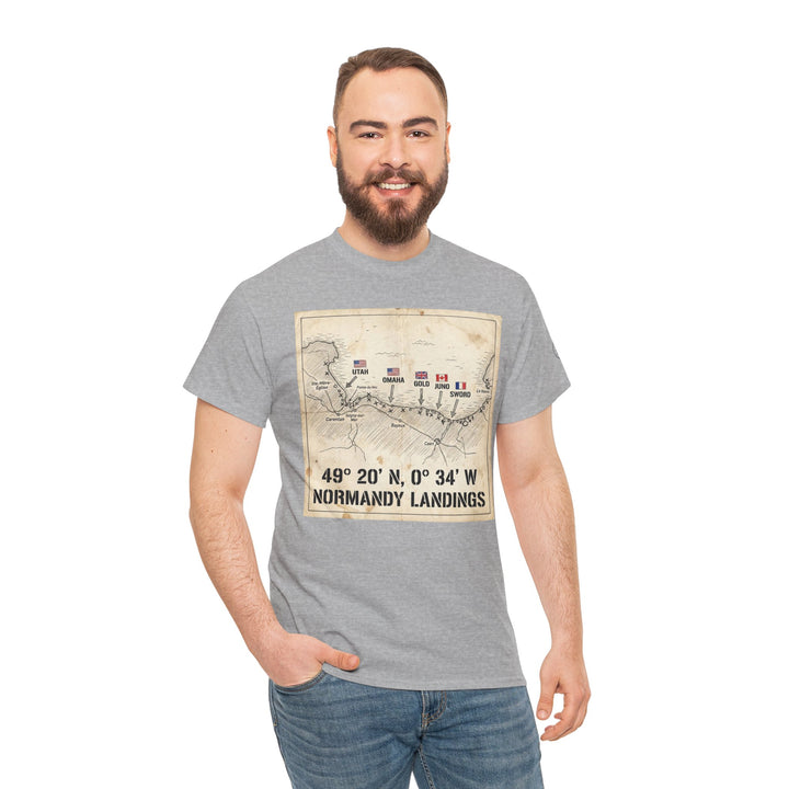 Gray graphic T-shirt with Normandy Landings map, by Veteran owned, worn with jeans by smiling man.