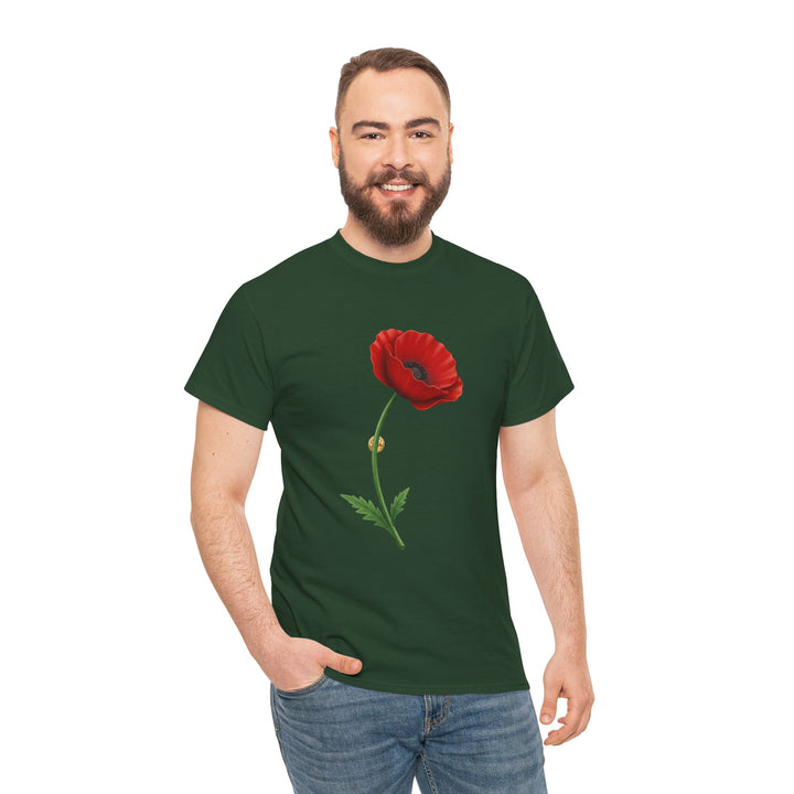 Forest green t-shirt by S&amp;W Gallus featuring a vibrant red poppy flower graphic, worn with blue jeans and a relaxed pose.
