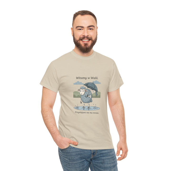 Beige graphic t-shirt by S&amp;W Gallus, featuring a cartoon sheep in the rain, worn with jeans.