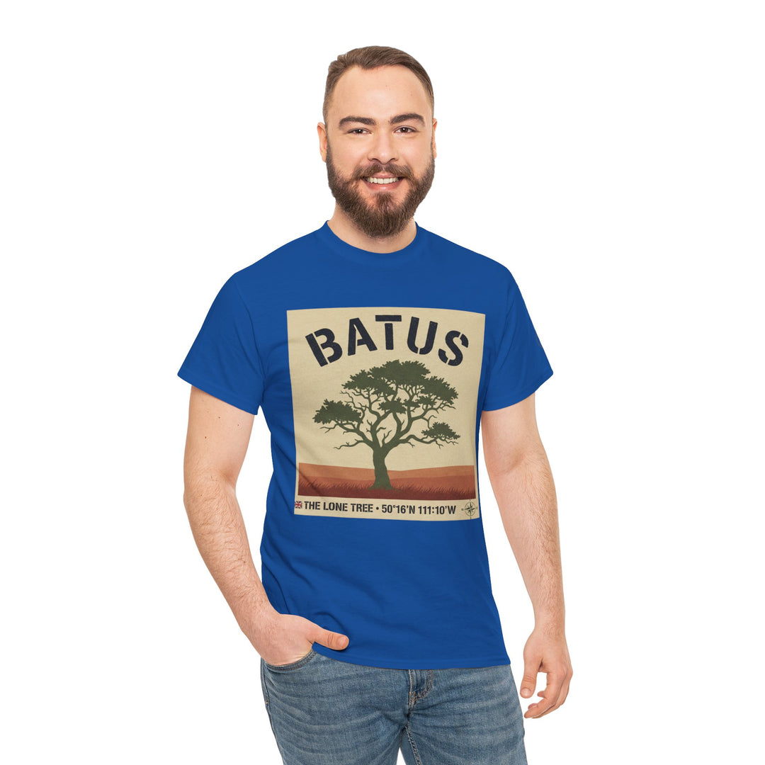 Blue graphic T-shirt by S&amp;W Gallus, featuring a tree on beige background with a compass and text, worn with jeans.