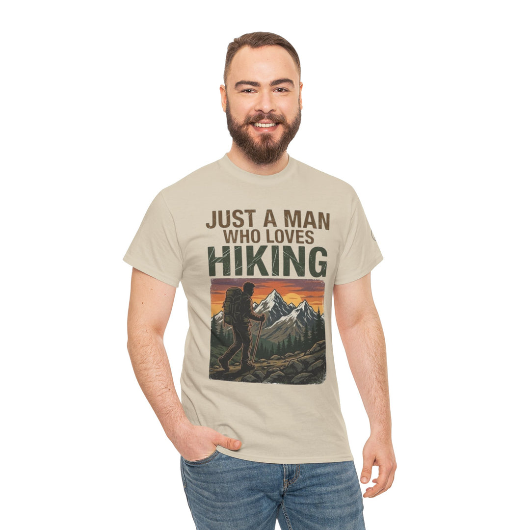 Tan graphic t-shirt by Veteran Owned, featuring a hiking-themed design, worn with blue jeans.