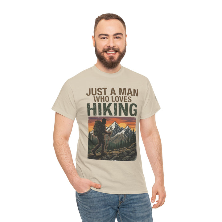 Tan graphic t-shirt by Veteran Owned, featuring a hiking-themed design, worn with blue jeans.